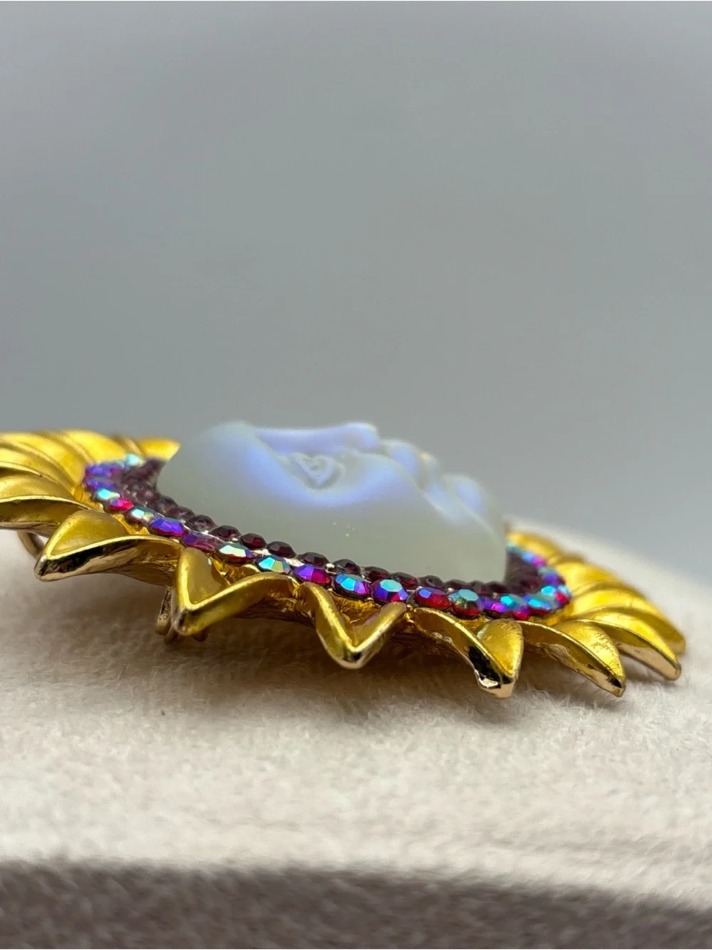Iridescent Moon Face Sunburst Fashion Brooch with Ruby Colored Aurora Rhinestone